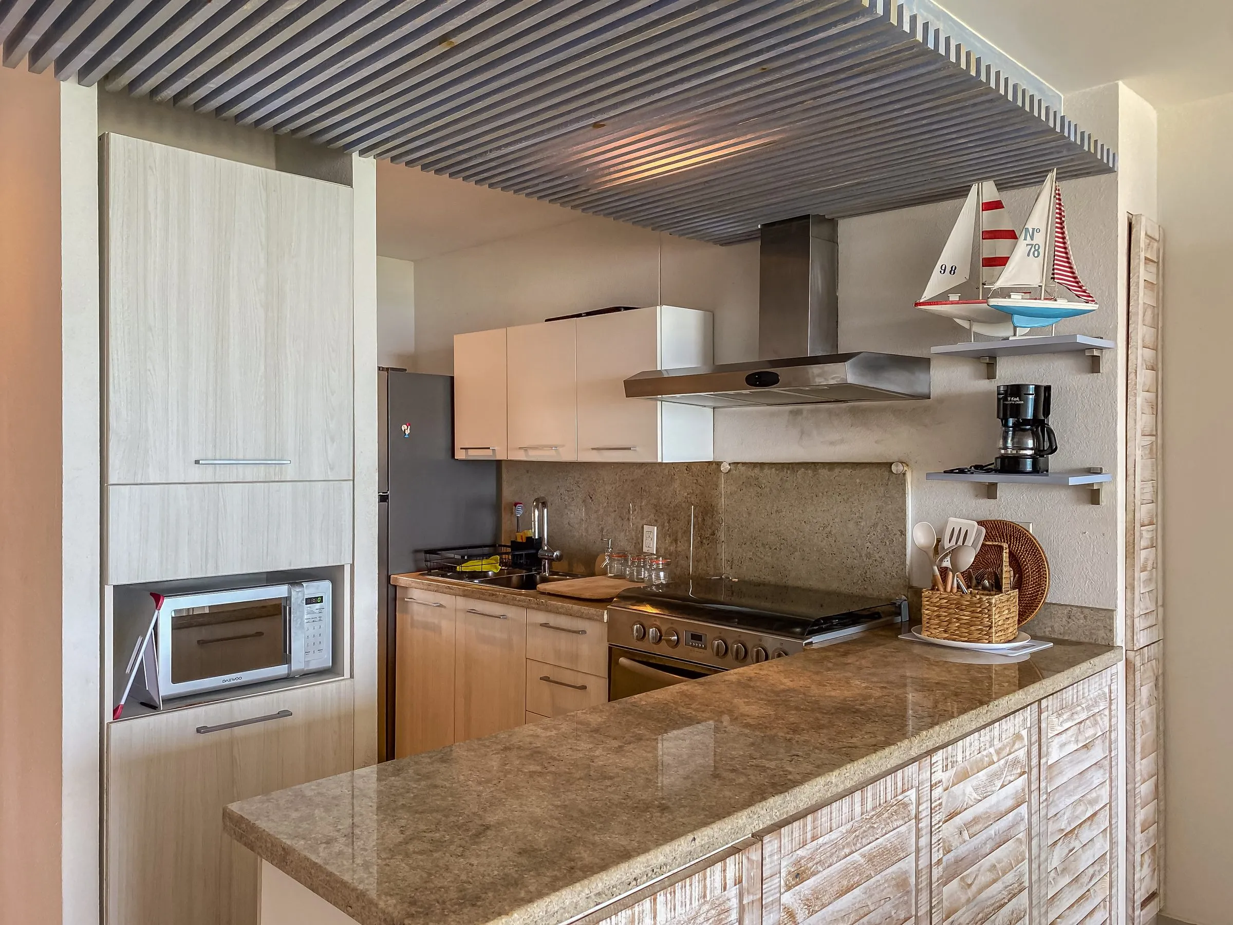 Vacation rental kitchen with clear counters, staged and ready for a shoot